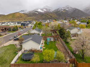 Birds eye view of property with a residential view and a mountain view