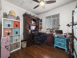 Office area featuring ceiling fan and dark wood-type flooring