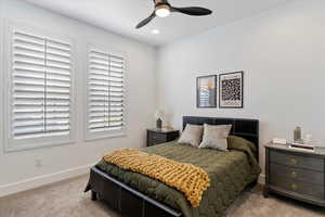 Carpeted bedroom with recessed lighting, a ceiling fan, and baseboards