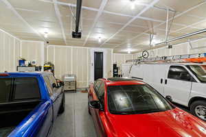 Garage featuring a garage door opener