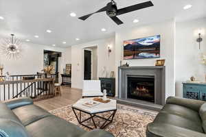 Living room featuring recessed lighting, wood finished floors, and ceiling fan