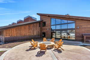 Back of house with a patio