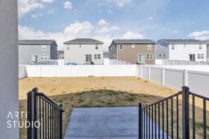 View of yard featuring a residential view, a patio, and a fenced backyard