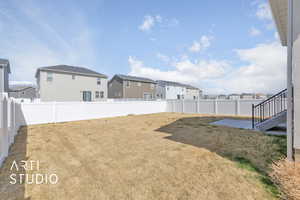 View of yard with a residential view and a fenced backyard