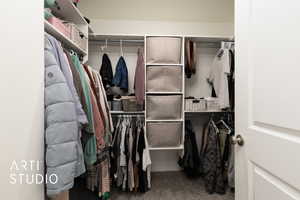 Walk in closet featuring carpet floors