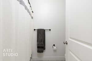 Full bath with baseboards