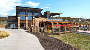 View of front of house featuring stone siding