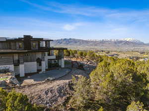 Back of house featuring a mountain view