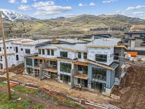 Back of property with a mountain view