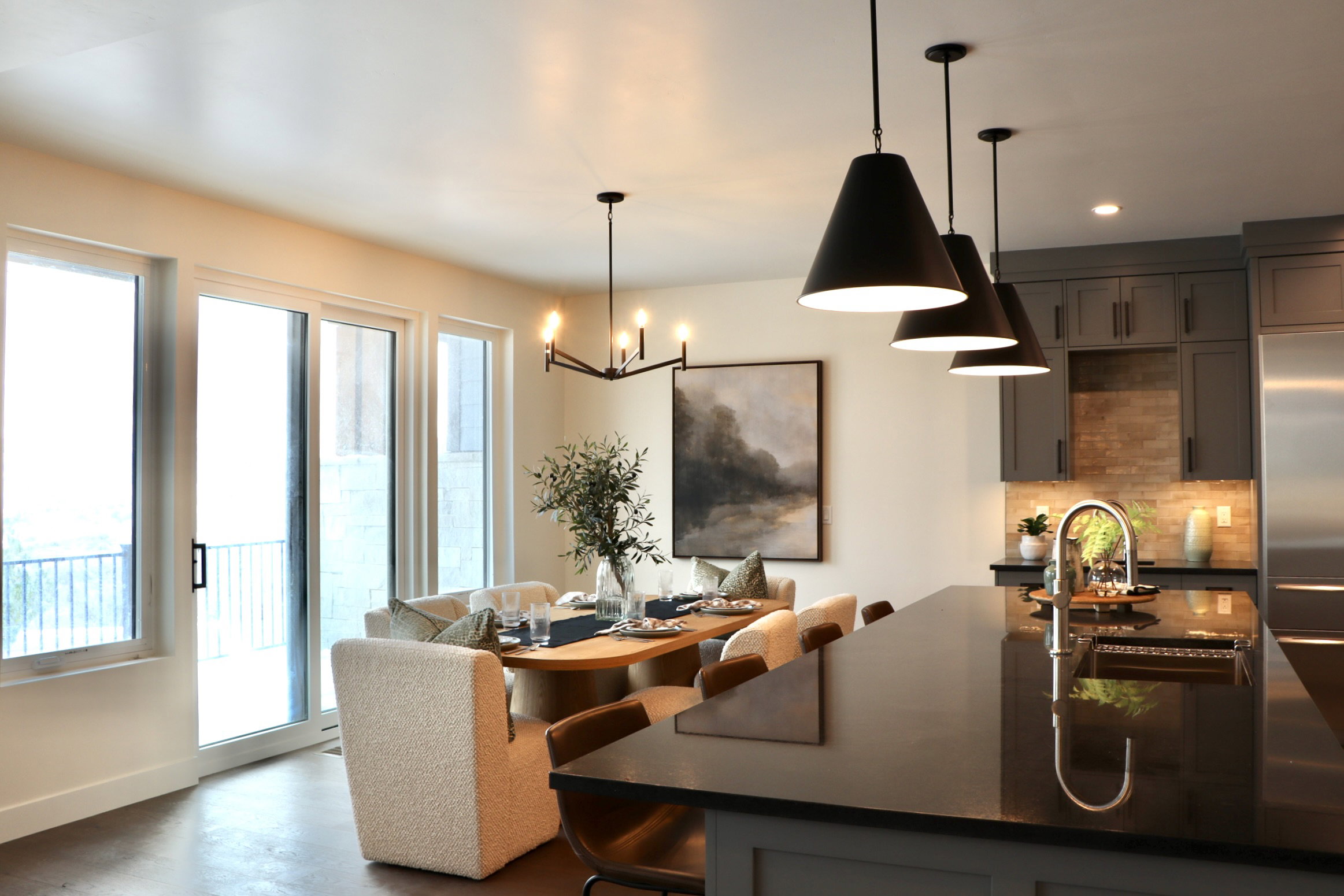 Dining space with a chandelier and recessed lighting