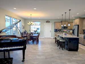 The expansive dining room is designed for gatherings, easily accommodating a large table with room to spare. Its open layout provides the flexibility to set up additional tables and seating.