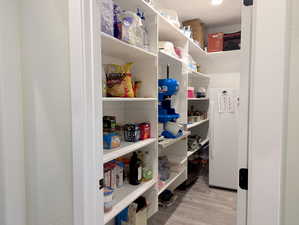 And for all your storage needs? A generously sized walk-in pantry awaits, offering ample shelving and storage.