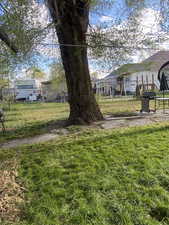 View of yard featuring fence