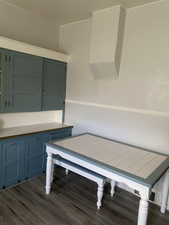 Unfurnished dining area featuring dark wood-style floors
