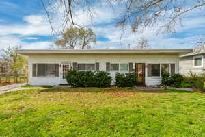Ranch-style house with a front lawn