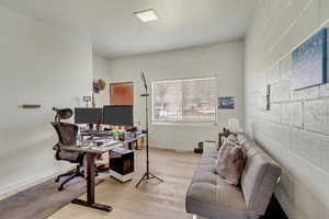 Office area featuring light wood-style flooring