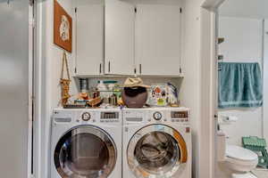 Laundry room with washer and dryer and laundry area