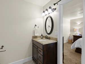 Bathroom with baseboards and vanity