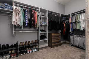 Spacious closet featuring carpet flooring