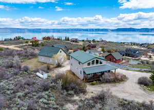 Bird's eye view featuring a water and mountain view and a residential view