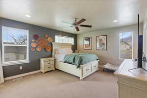 Bedroom featuring recessed lighting, visible vents, a ceiling fan, baseboards, and light colored carpet