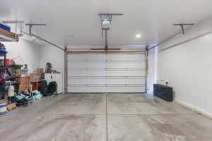 Garage featuring a garage door opener