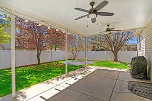 View of patio / terrace featuring a fenced backyard, a grill, and ceiling fan
