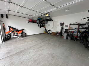 Garage featuring a garage door opener