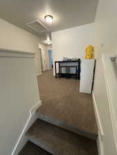 Stairs with baseboards and carpet floors