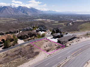 Birds eye view of property with a mountain view and a residential view