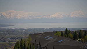 Exterior space with a water and mountain view