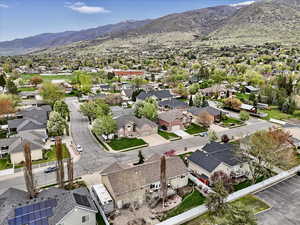 Drone / aerial view with north east mountain view and a residential view