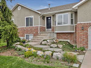 Beautiful landscaping with perennials throughout.