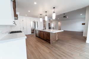 Kitchen with recessed lighting, a sink, appliances with stainless steel finishes, open floor plan, and ceiling fan
