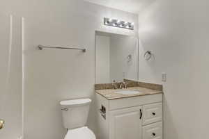 Half bath with toilet and vanity