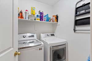Laundry area featuring washer and dryer and laundry area