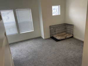 Spare room with carpet floors and baseboards