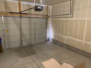Garage featuring a garage door opener