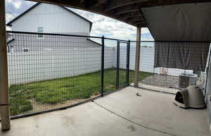 View of patio featuring a fenced backyard and central AC