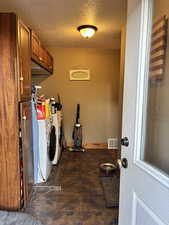 Washroom with washing machine and dryer, cabinet space,