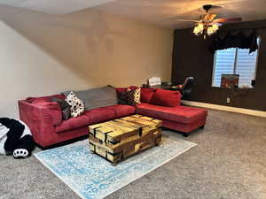 Family room featuring carpet floors and ceiling fan
