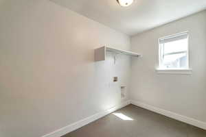 Laundry room featuring visible vents, hookup for a washing machine, baseboards, and laundry area