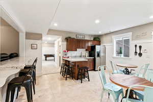 Dining space featuring recessed lighting and baseboards