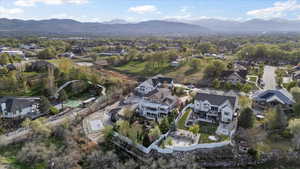 Birds eye view of property with a residential view and a mountain view