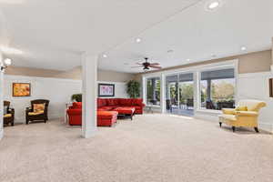 Living room featuring recessed lighting, carpet, ceiling fan, and plenty of natural light