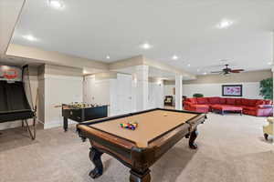 Game room featuring light colored carpet, baseboards, and recessed lighting