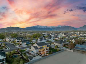 Birds eye view of property with a mountain view and a residential view