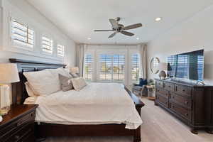 Bedroom with ceiling fan, recessed lighting, and light colored carpet