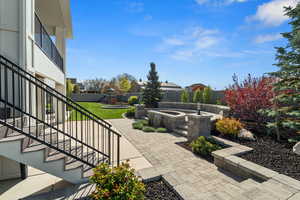 View of patio / terrace with a fenced backyard, stairs, and a playground