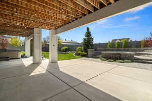 View of patio / terrace featuring a hot tub and a fenced backyard